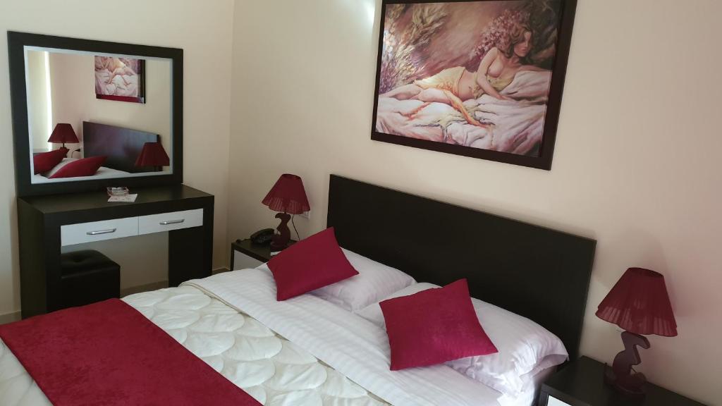 Postel nebo postele na pokoji v ubytování Haris Hotel