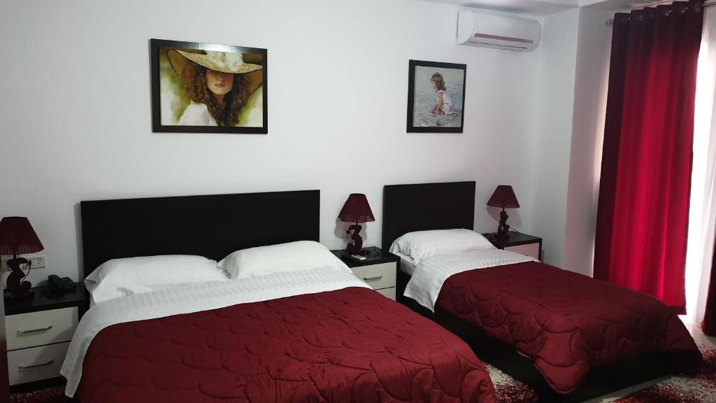 Postel nebo postele na pokoji v ubytování Haris Hotel