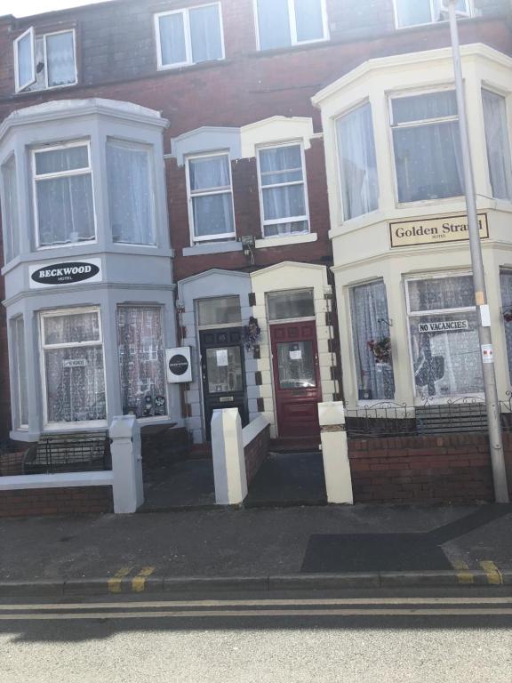 a group of buildings on the side of a street at The Beckwood Hotel in Blackpool