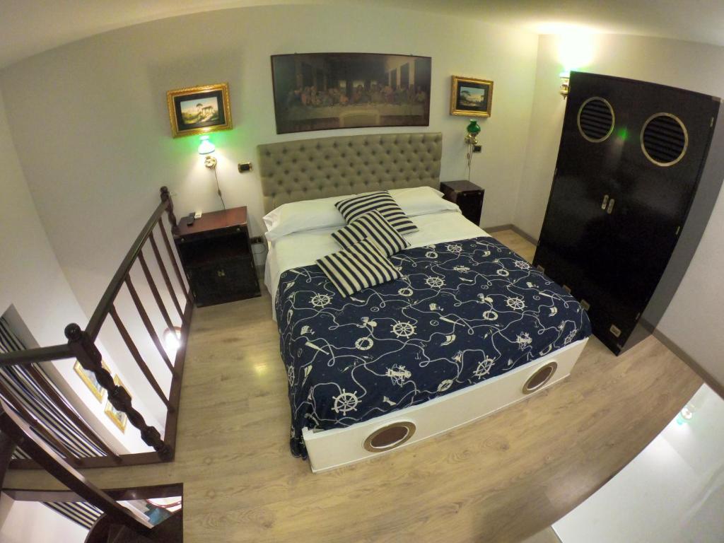 Postel nebo postele na pokoji v ubytování Hotel Ausonia