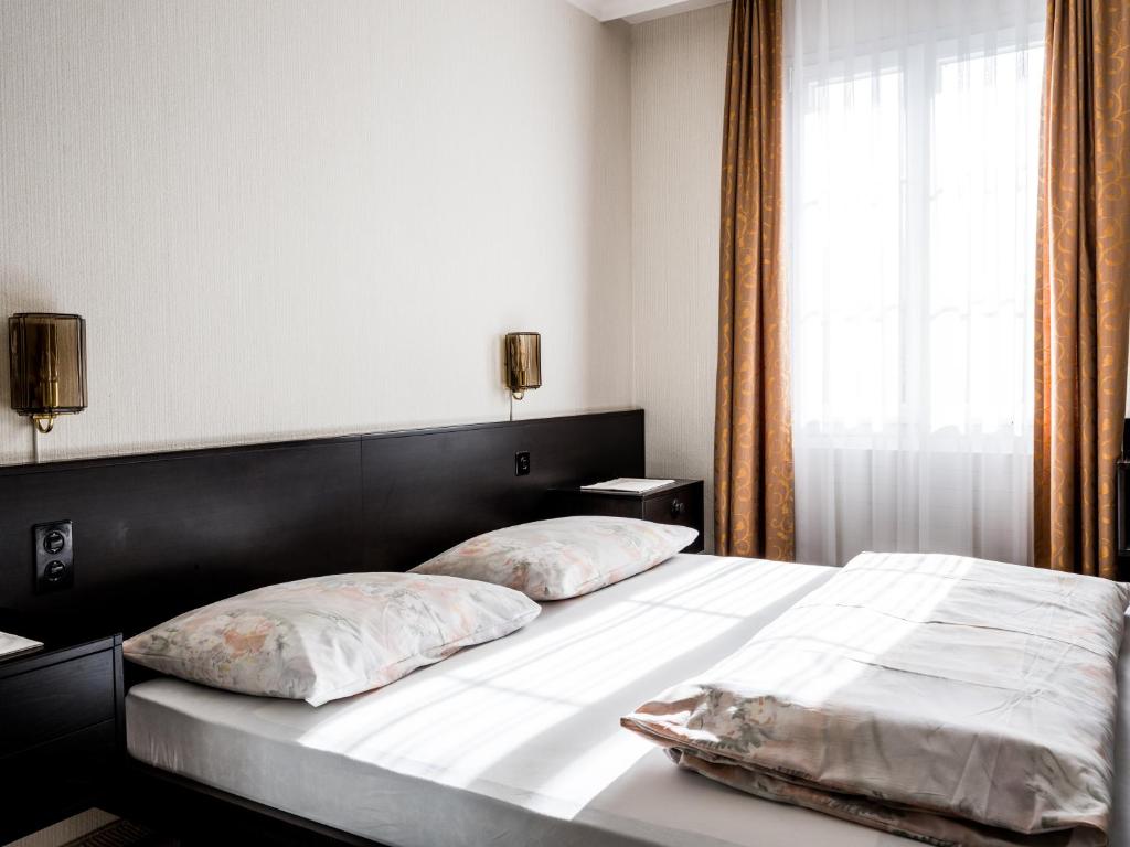 Ένα ή περισσότερα κρεβάτια σε δωμάτιο στο Landgasthof Hotel Menzberg