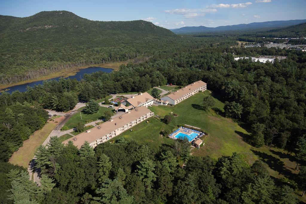 an aerial view of a house with a swimming pool at Fox Ridge Resort in North Conway