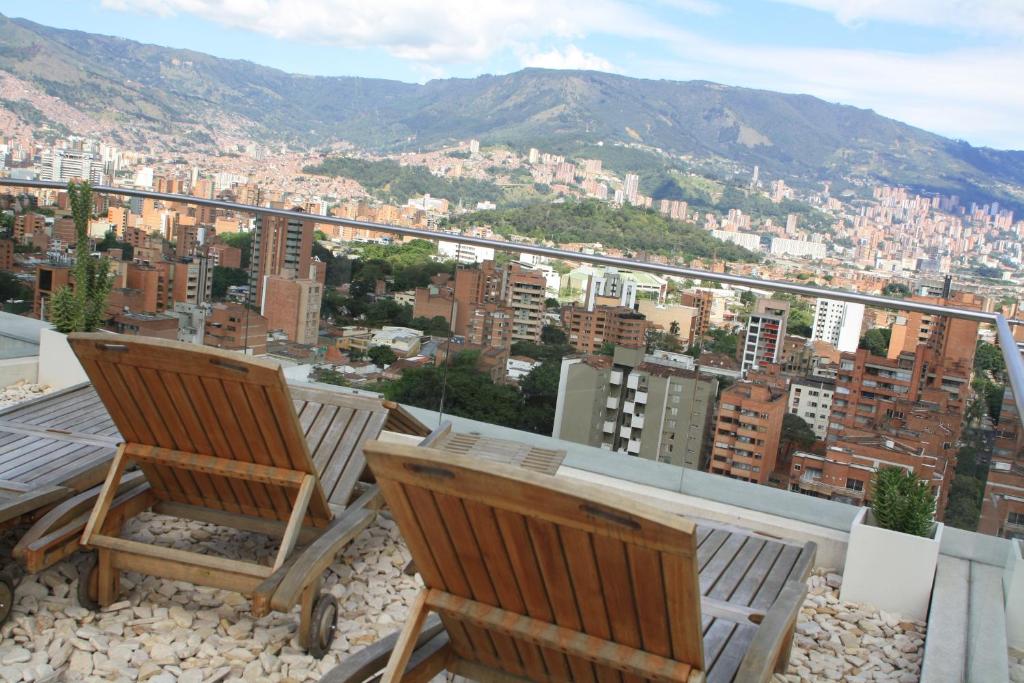 a row of chairs sitting on top of a hill at Inntu Hotel in Medellín