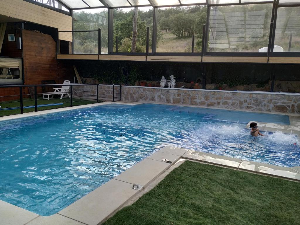 The swimming pool at or close to Posada Rural SPA Granja LA TEJERA de Lozoya