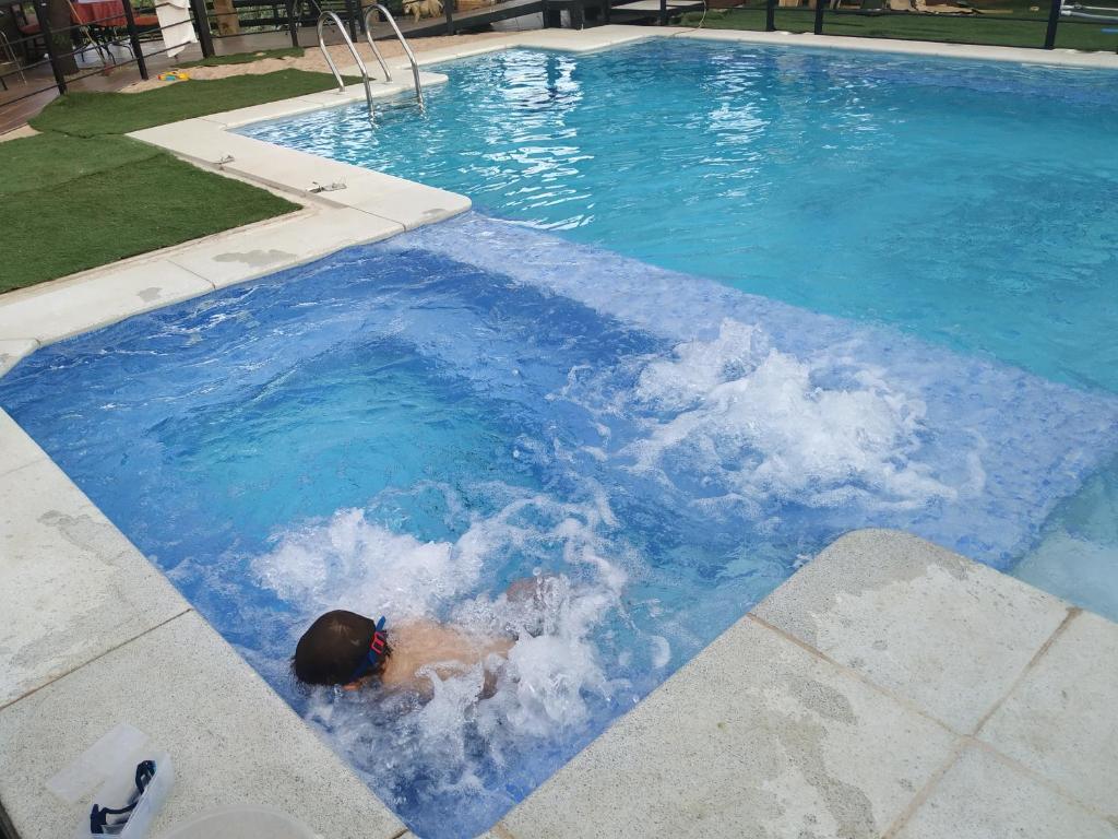 The swimming pool at or close to Posada Rural SPA Granja LA TEJERA de Lozoya