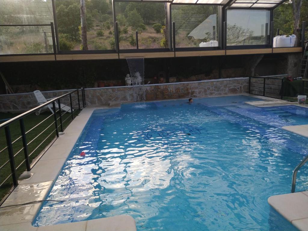 The swimming pool at or close to Posada Rural SPA Granja LA TEJERA de Lozoya