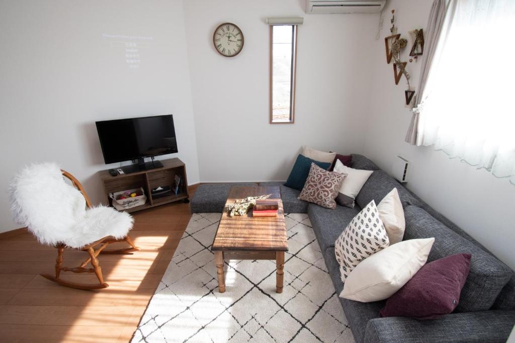 a living room with a couch and a table at Sumida-ku - House - Vacation STAY 82129 in Tokyo