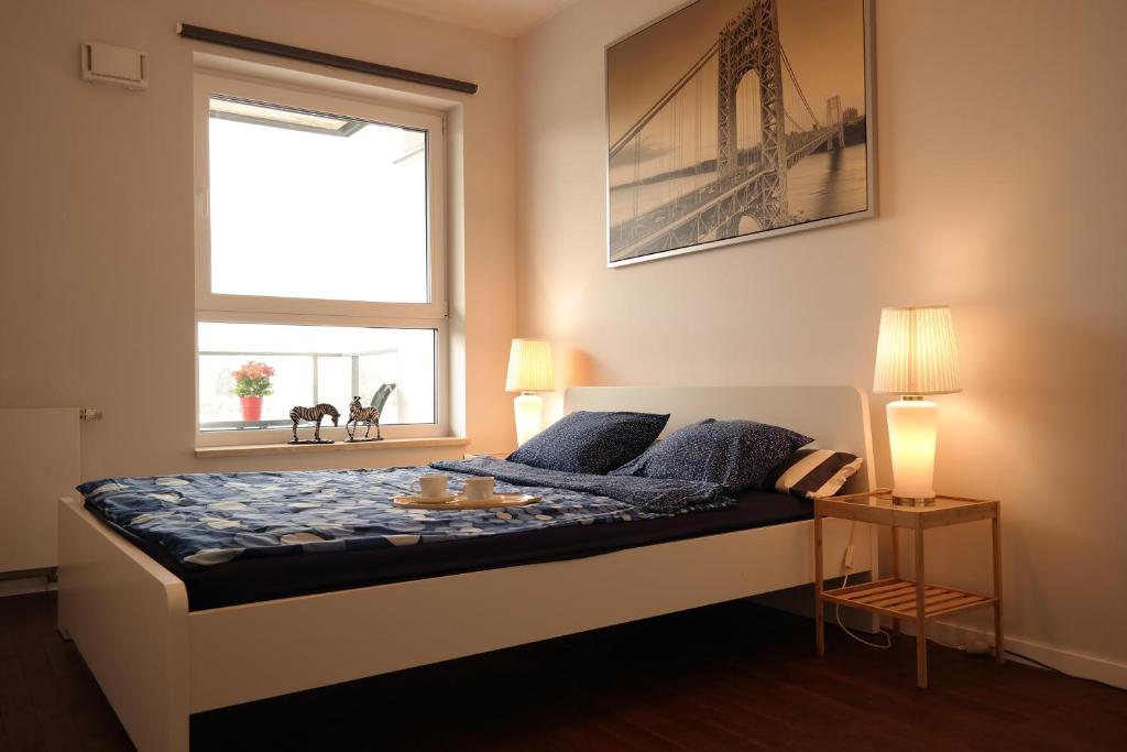Posteľ alebo postele v izbe v ubytovaní Apartament Nadwarciański