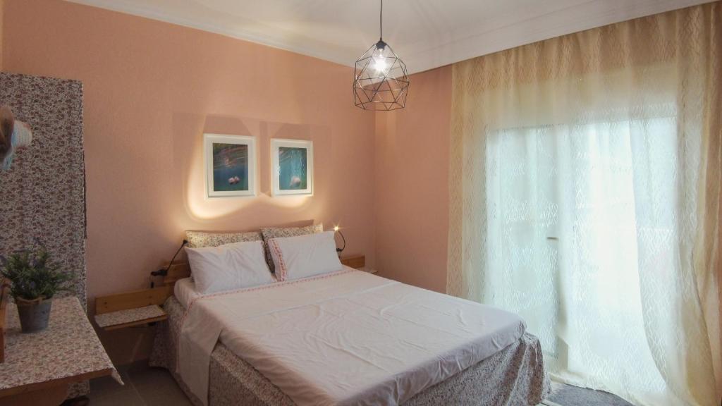 Postel nebo postele na pokoji v ubytování Medusa Beach Apartment, Asprovalta