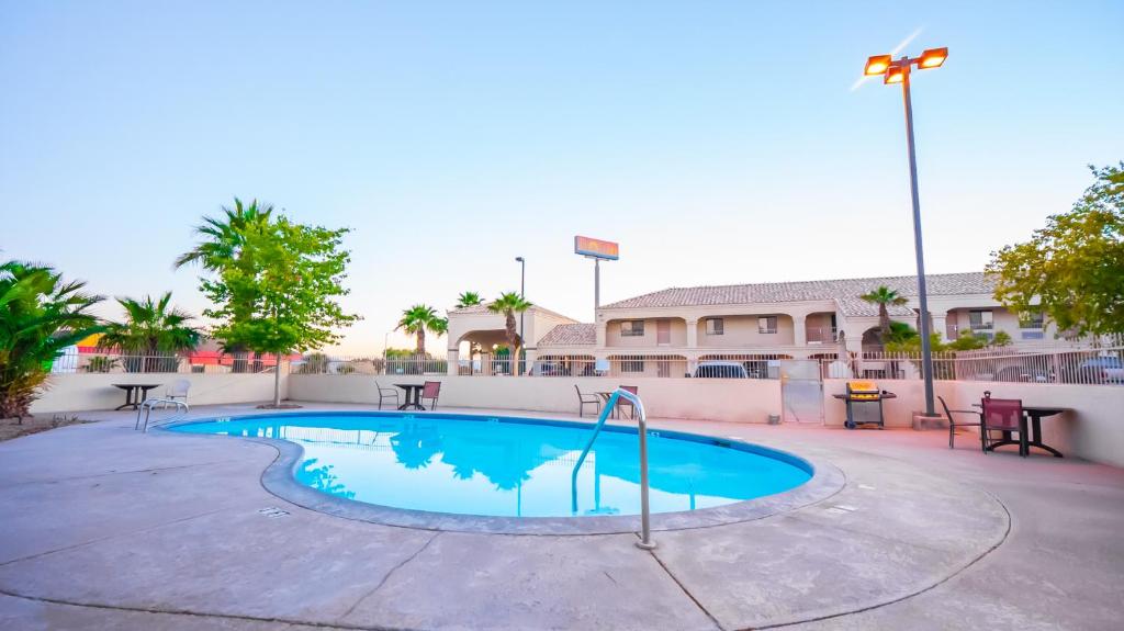 a large swimming pool with a blue sky at Rio Del Sol Inn Needles in Needles