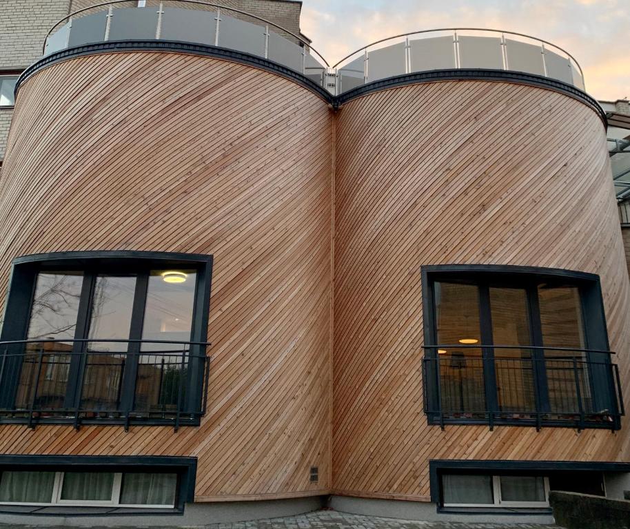 two windows on the side of a building at Palanga Dome apartment in Palanga