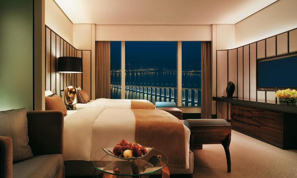Postel nebo postele na pokoji v ubytování MGM Macau