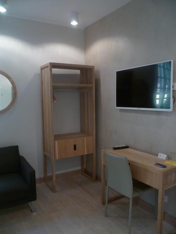 TV a/nebo společenská místnost v ubytování Hotel Rossetti