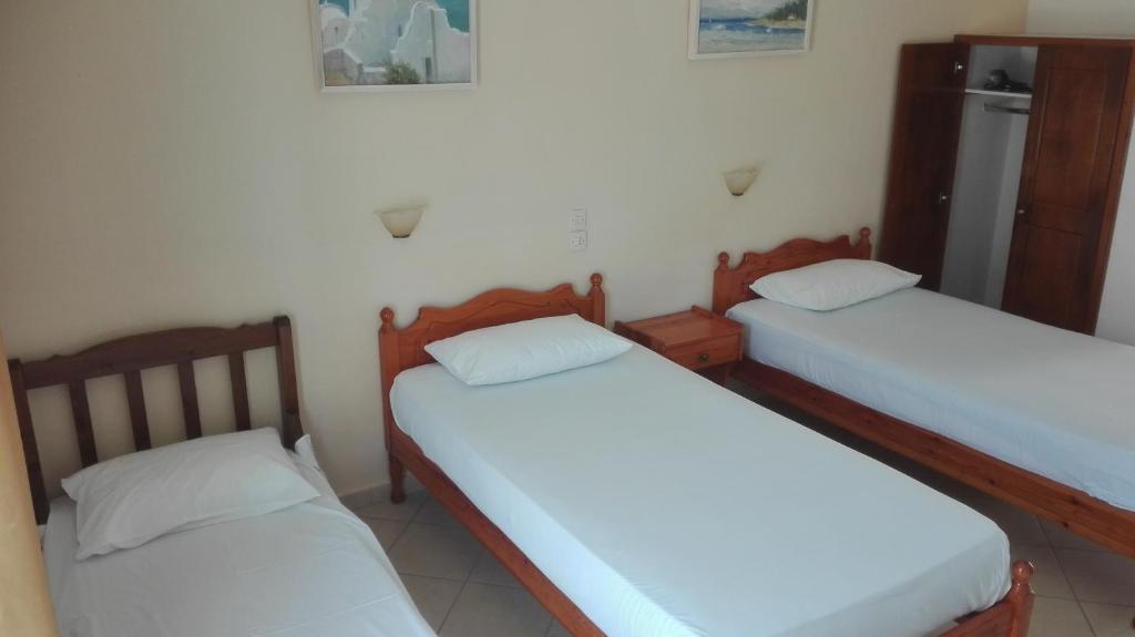 Postel nebo postele na pokoji v ubytování Alexandros Guest House