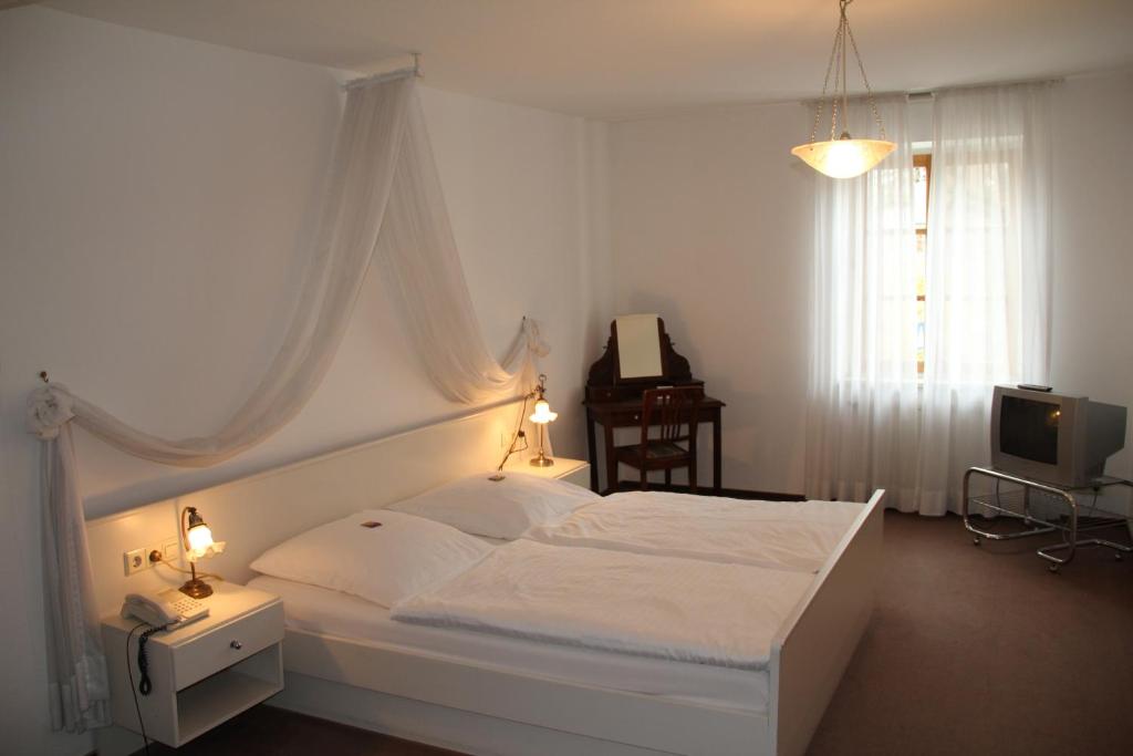 En eller flere senger på et rom på Hotel Linde Leutkirch