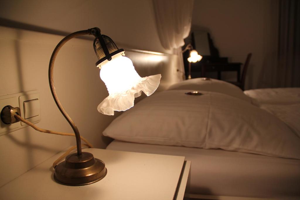 Postel nebo postele na pokoji v ubytování Hotel Linde Leutkirch