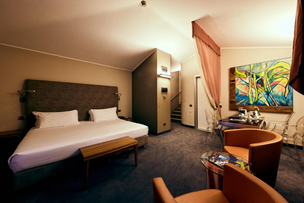Postel nebo postele na pokoji v ubytování Settecento Hotel