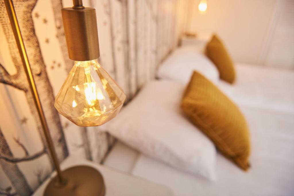 Een bed of bedden in een kamer bij Hotel Steeds aan Zee