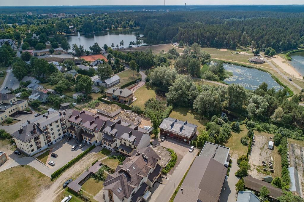 an aerial view of a campus with a river and buildings at SR Apartamentai in Druskininkai
