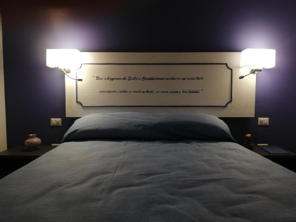 Postel nebo postele na pokoji v ubytování Miti Dello Stretto B&B