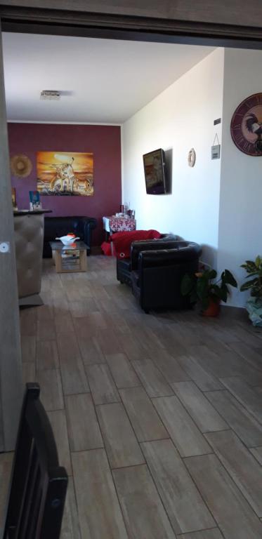 a living room with a couch and a table at Valeri 's Country House in Sperlonga
