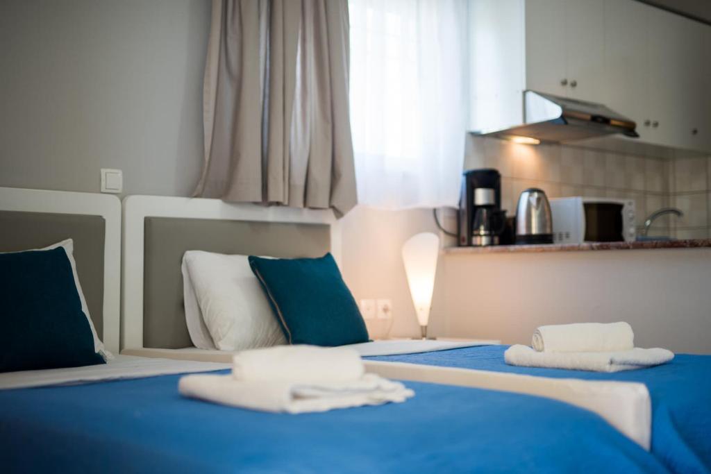 Postel nebo postele na pokoji v ubytování Katerina Hotel