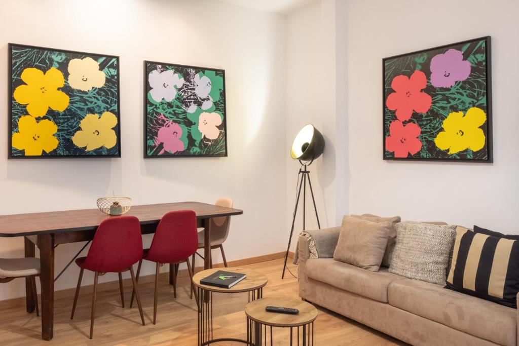 a living room with a couch and a table at Historical Central Apartment with Interior Terrace 62 by Lisbonne Collection in Lisbon