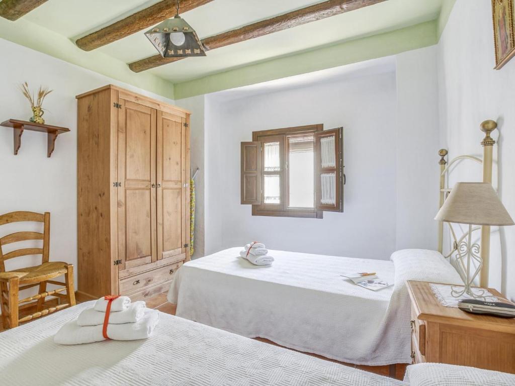 Łóżko lub łóżka w pokoju w obiekcie Villa in Carcabuey near Sierras Subbeticas Park