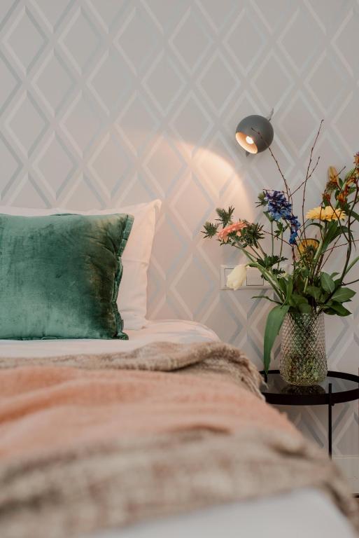 Een bed of bedden in een kamer bij Hotel Steeds aan Zee