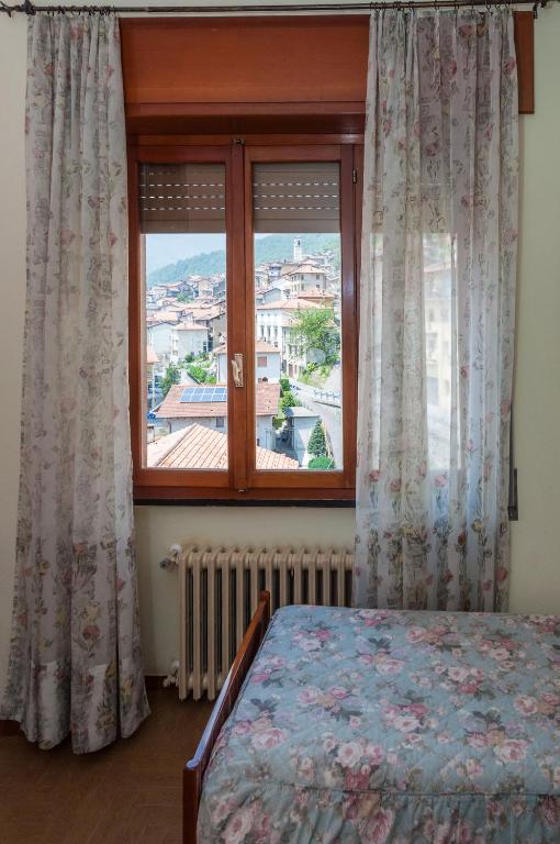 Una cama o camas en una habitación de Albergo De Jean