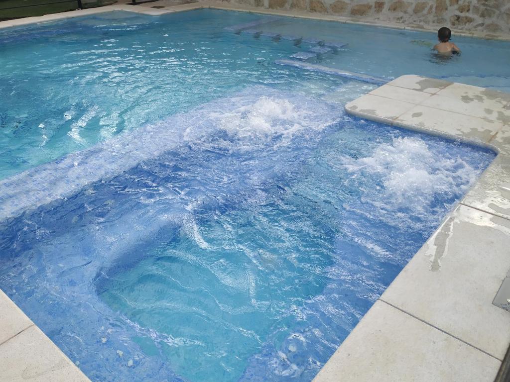 The swimming pool at or close to Posada Rural SPA Granja LA TEJERA de Lozoya