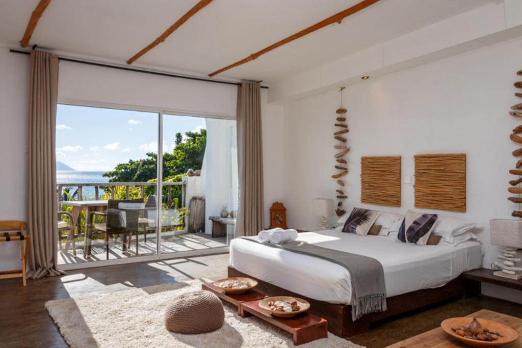 Postel nebo postele na pokoji v ubytování Bliss Boutique Hotel Seychelles