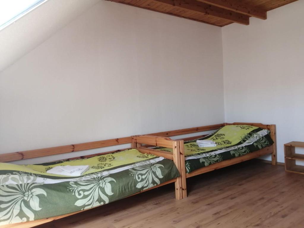 Postel nebo postele na pokoji v ubytování Gesztenye Vendégház