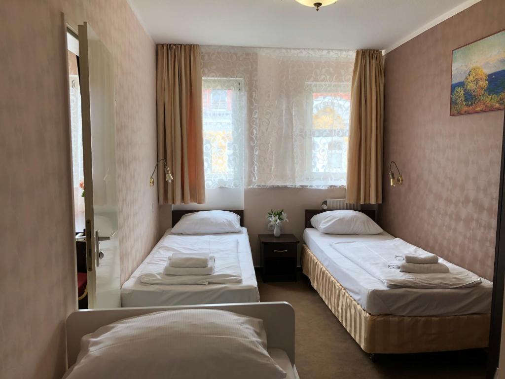 Postel nebo postele na pokoji v ubytování Atlas Berlin Hotel