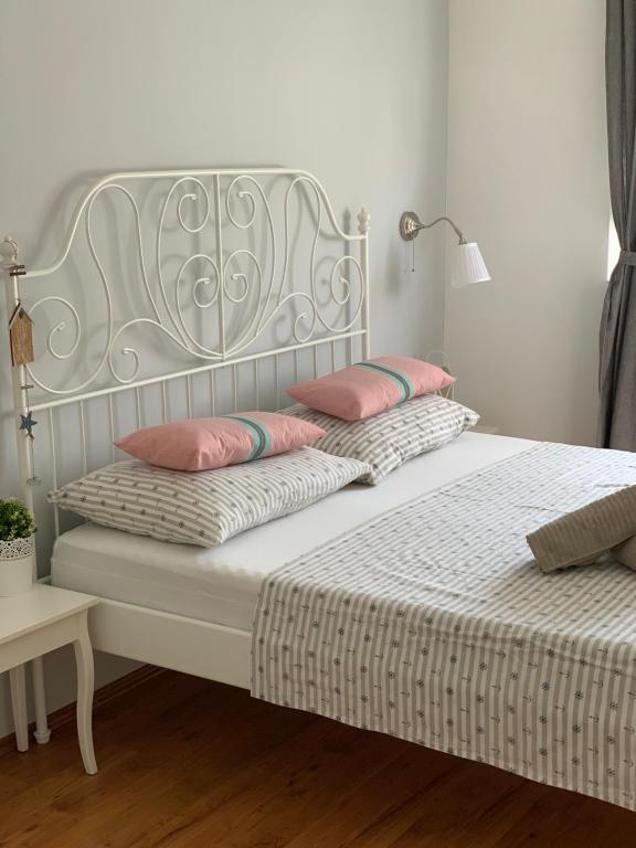 Posteľ alebo postele v izbe v ubytovaní Apartmani Maksan