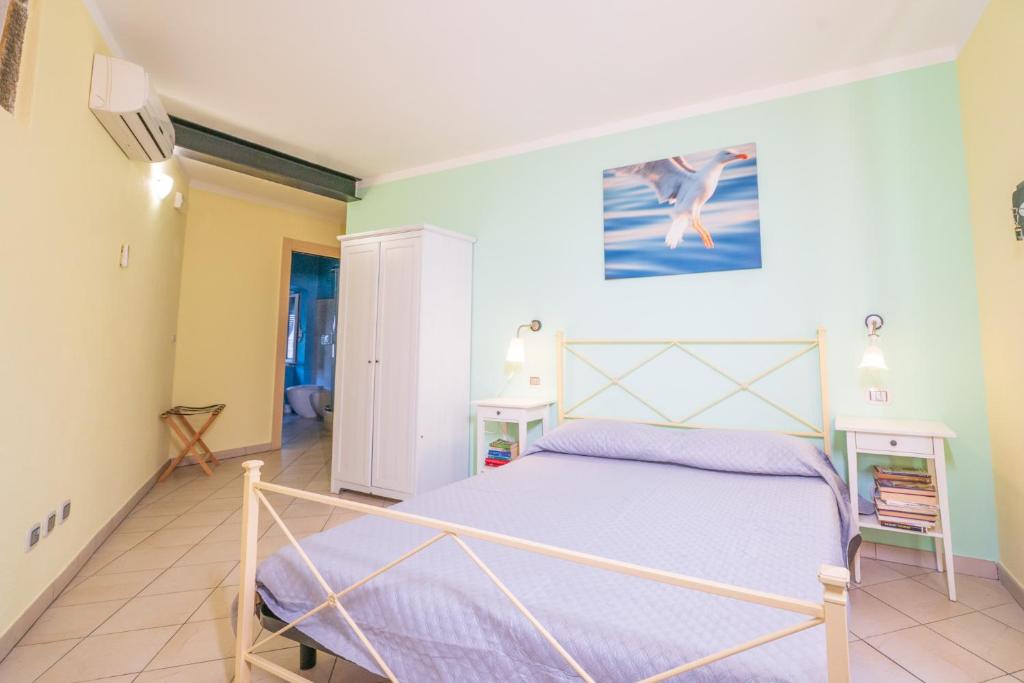 Postel nebo postele na pokoji v ubytování Cà du Nilo