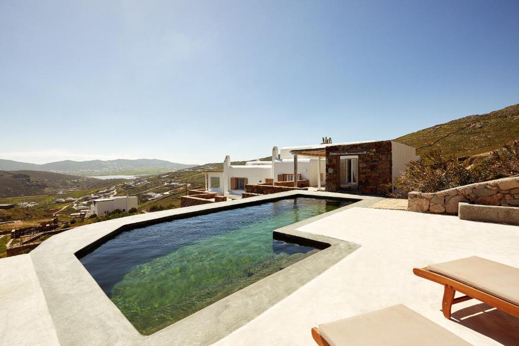 a swimming pool in a villa with a view at Mykonos Dunes Villas in Mikonos