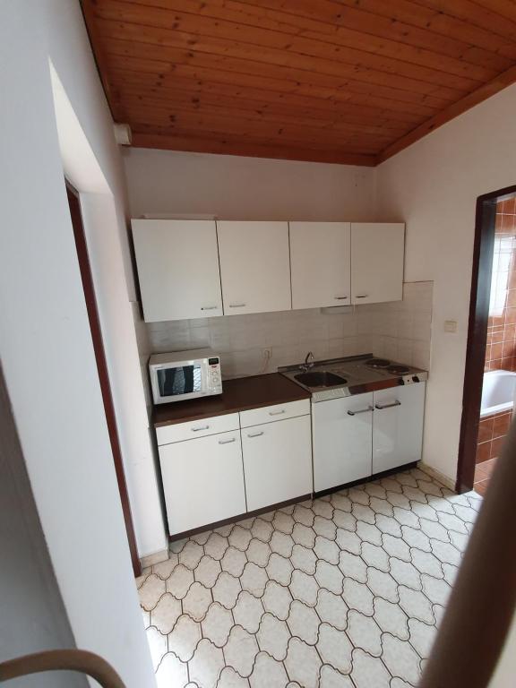 Kuchyň nebo kuchyňský kout v ubytování Appartements Amrusch