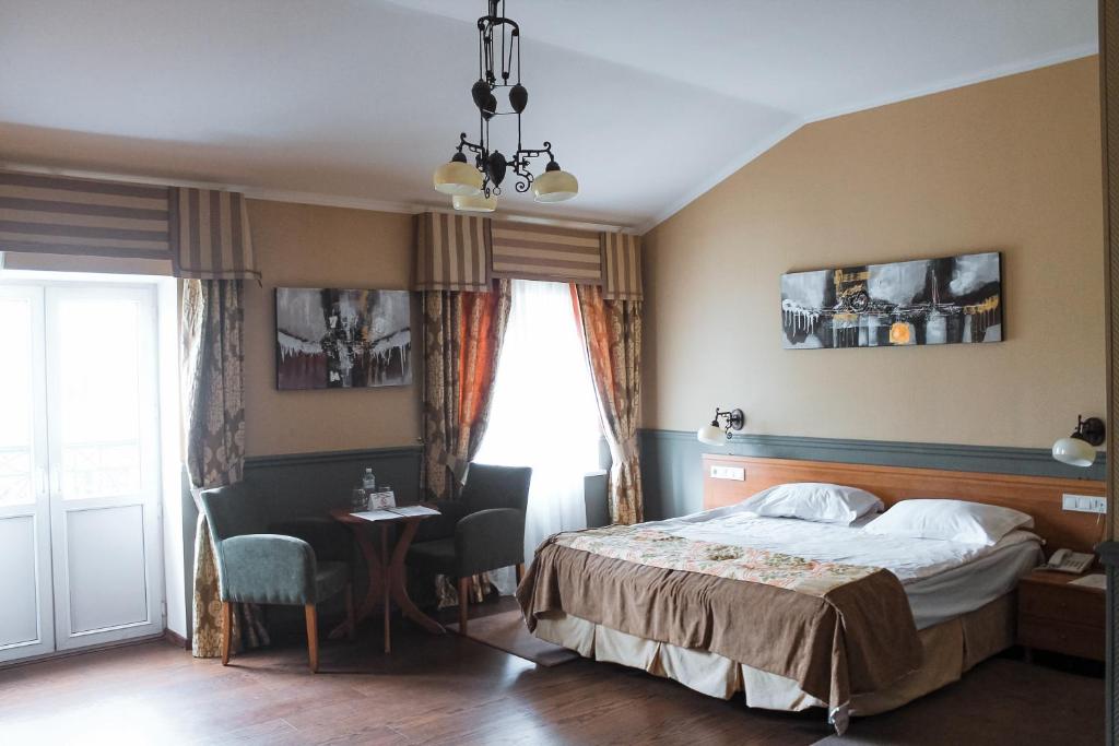 Postel nebo postele na pokoji v ubytování Frapolli Hotel on Deribasivska street