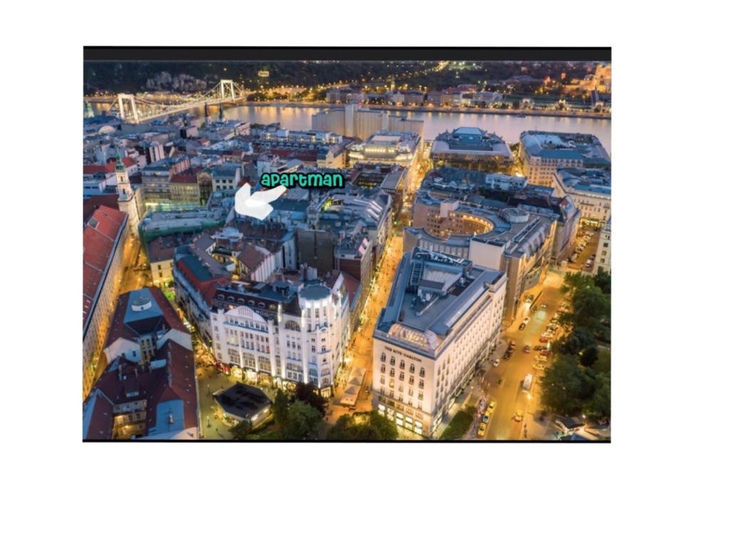 an aerial view of a city at night at Hungaricum Budapest in Budapest
