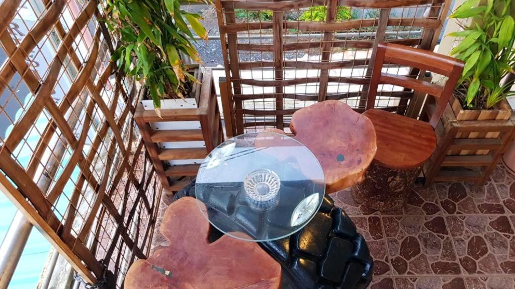 an overhead view of a table and chairs with a motorcycle at One bedroom appartement with city view furnished terrace and wifi at Souillac in Souillac