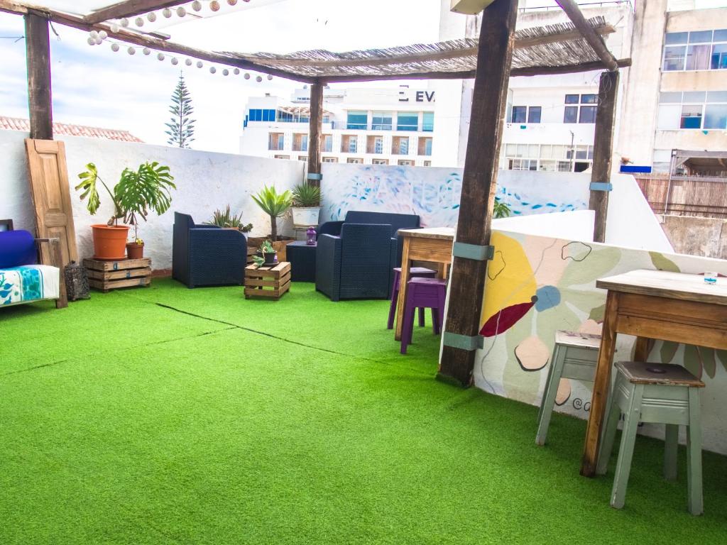 a patio with green grass on the floor at RIA Terrace in Faro