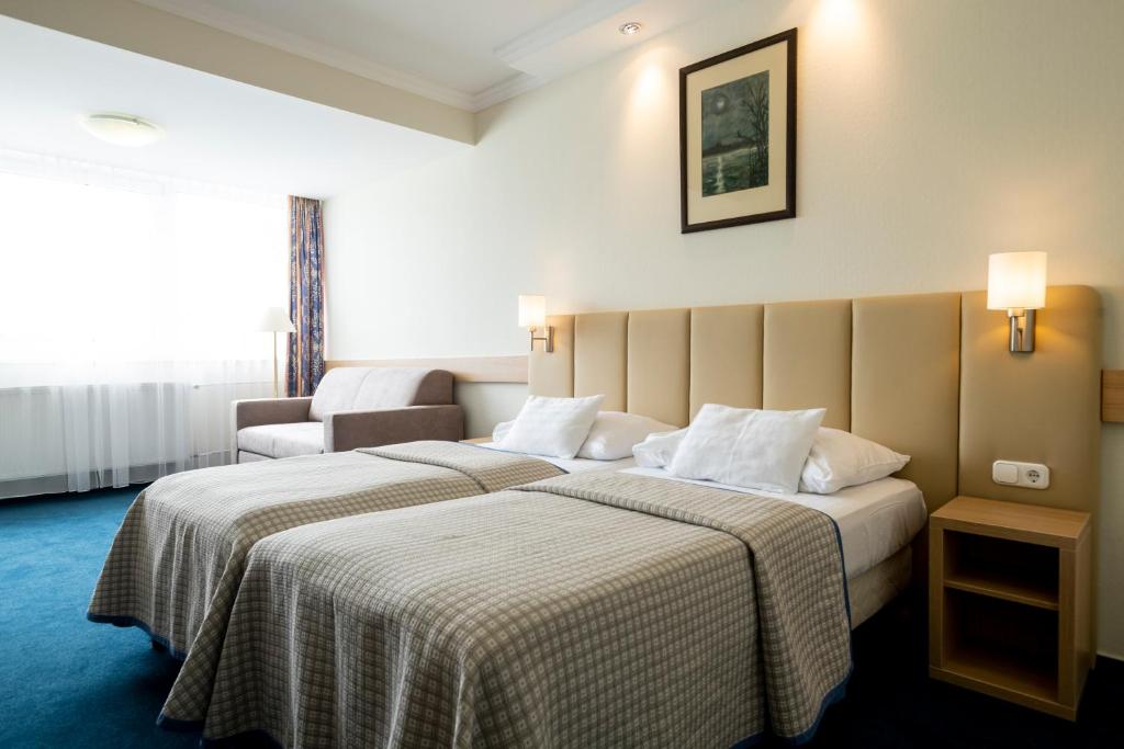 Posteľ alebo postele v izbe v ubytovaní Hotel Marina Port