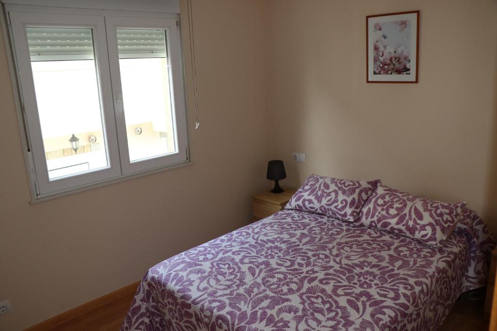 Postel nebo postele na pokoji v ubytování Apartamentos Lidia
