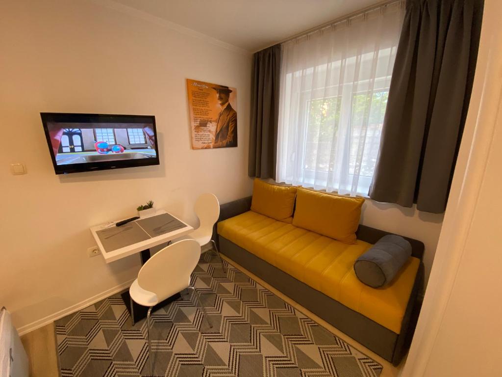 TV a/nebo společenská místnost v ubytování Apartments & Rooms Mostar Story