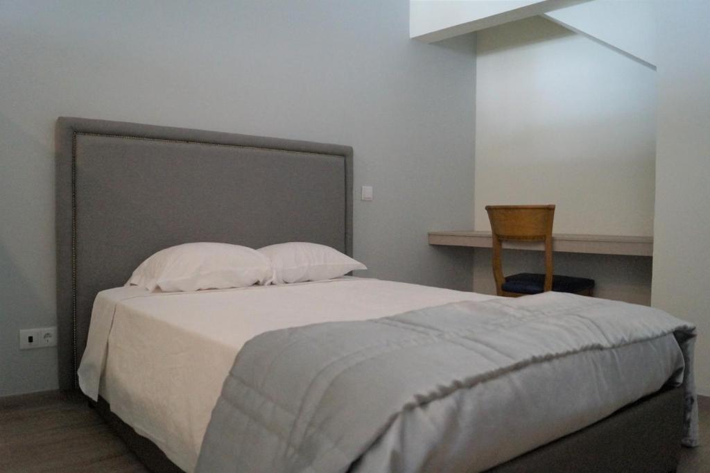 Postel nebo postele na pokoji v ubytování Angra Central Hotel