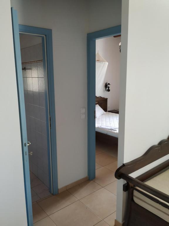 Postel nebo postele na pokoji v ubytování Villa Ioanna Tinos
