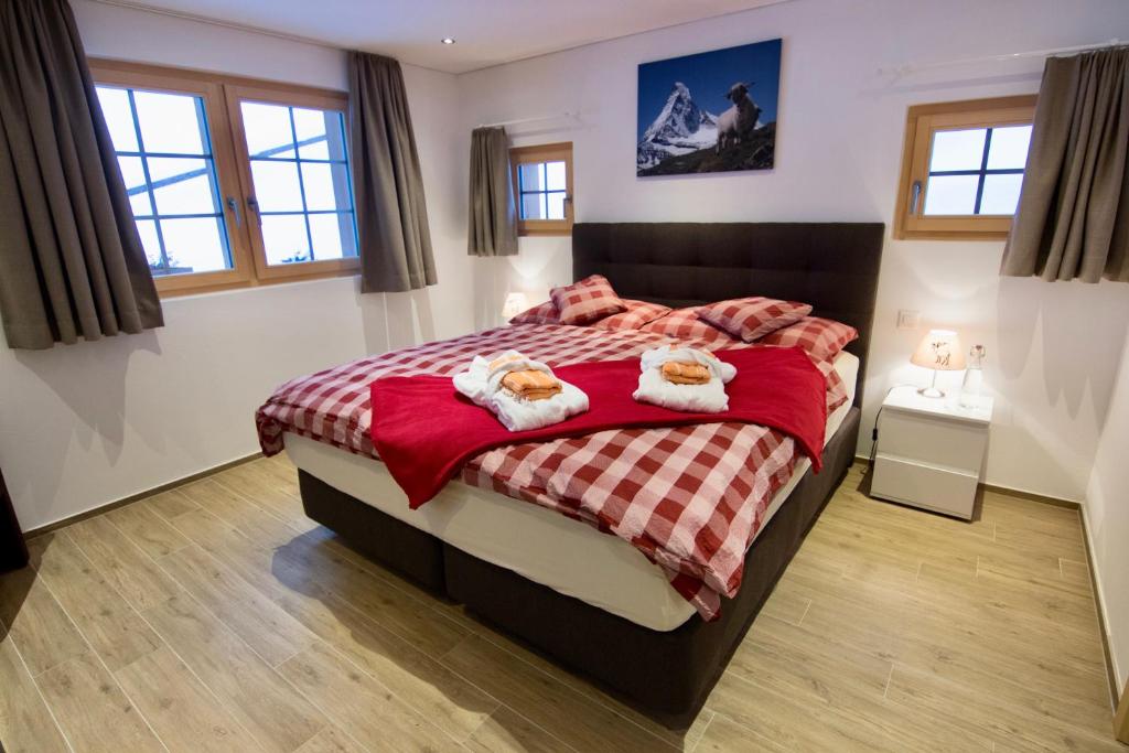 Postel nebo postele na pokoji v ubytování Element Chalets Zermatt
