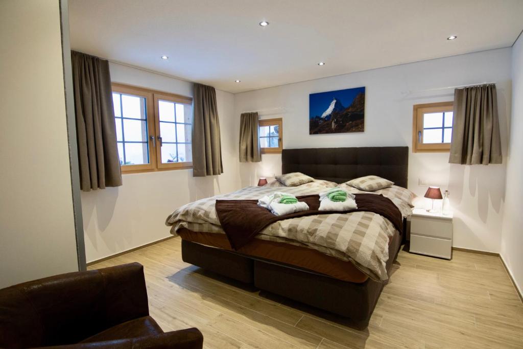 Postel nebo postele na pokoji v ubytování Element Chalets Zermatt
