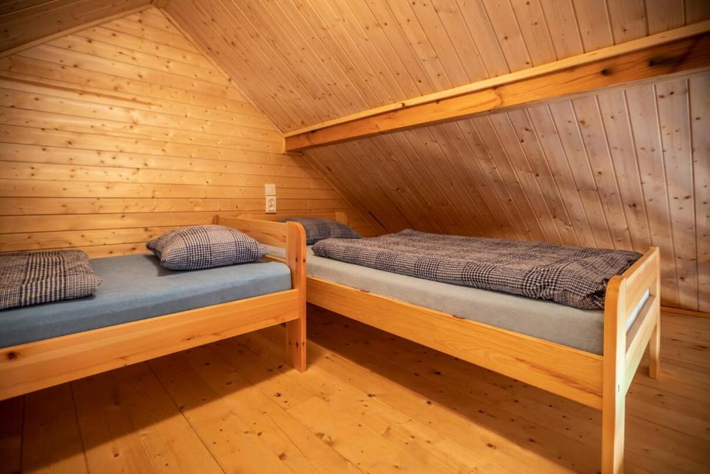 Postel nebo postele na pokoji v ubytování O.W.Cynamon